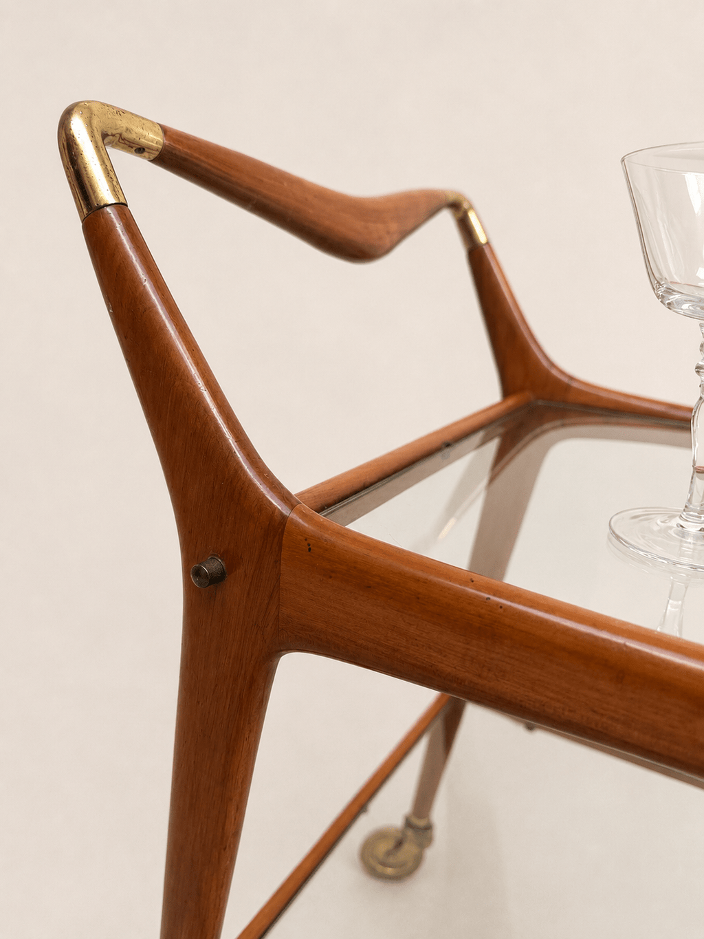 1950s Italian glass and wood bar cart - wooden handle with brass end cap, close-up
