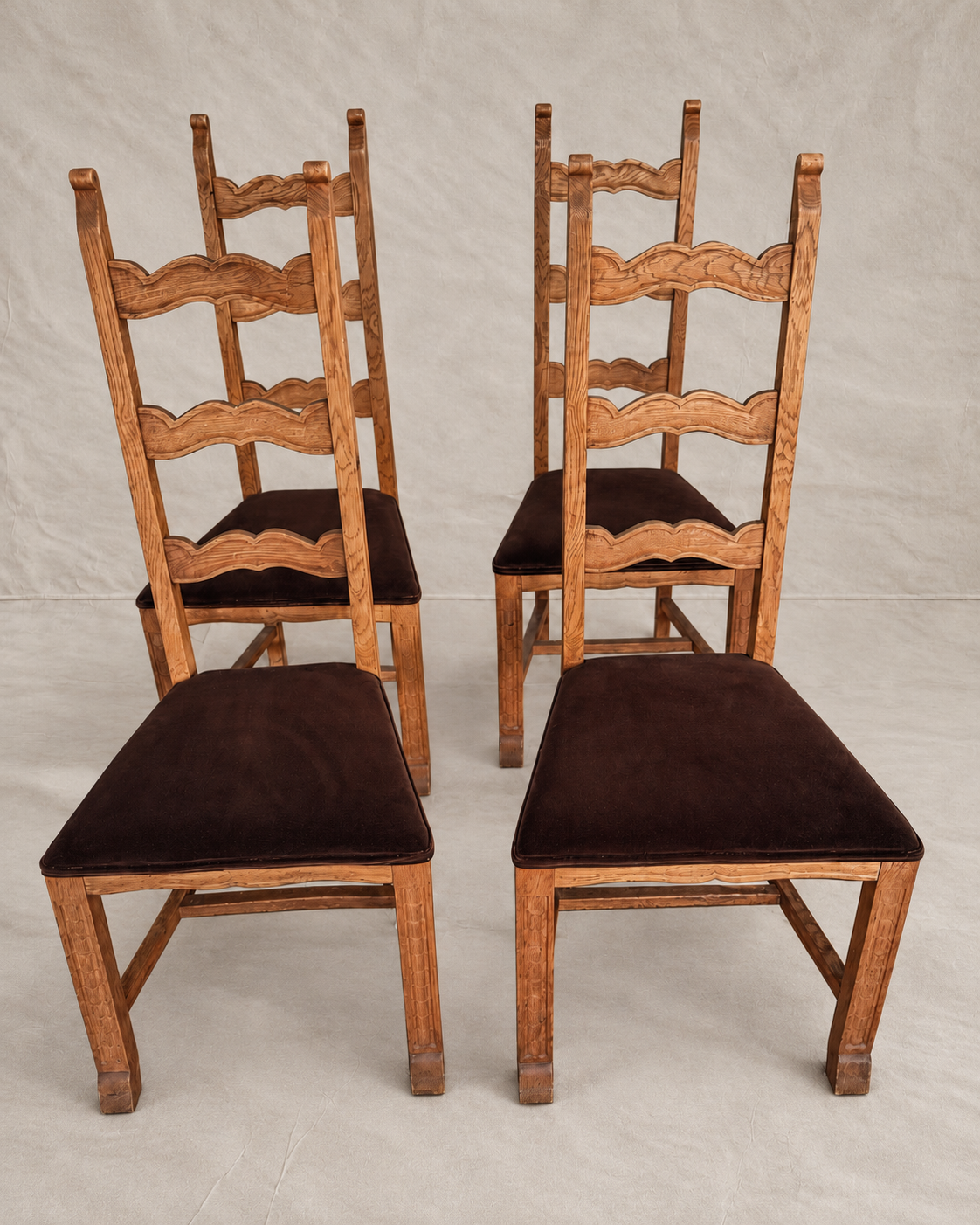 Skønvirke-style carved oak dining chairs with Rose Uniacke brown cotton velvet seats in Logwood