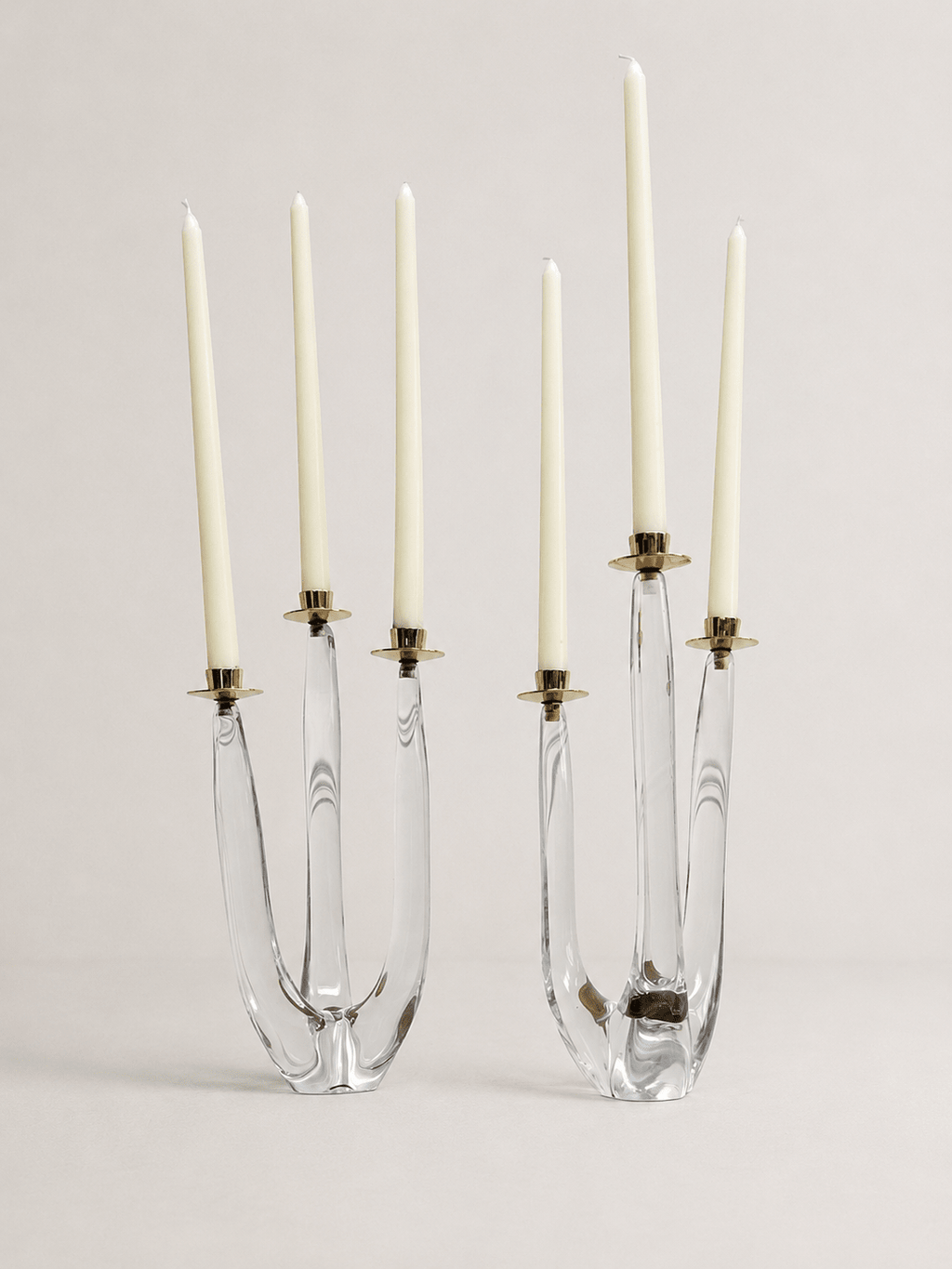 Pair of mid-century sculptural clear glass three-arm candelabras