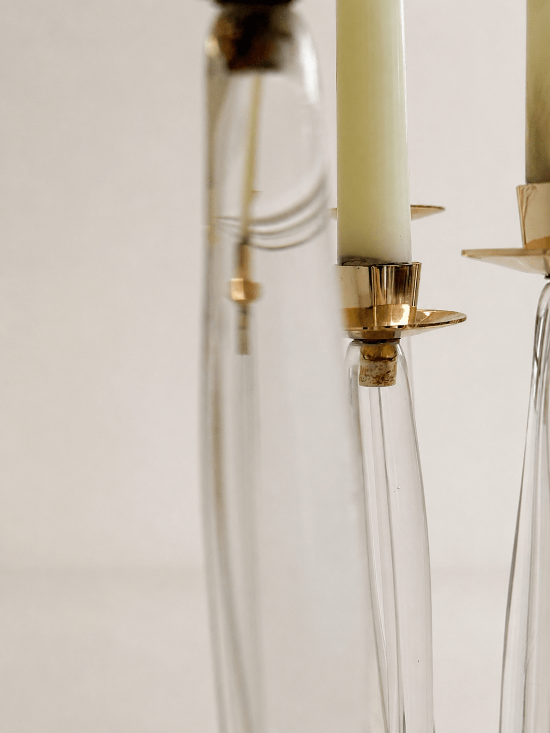 Pair of mid-century sculptural clear glass three-arm candelabras