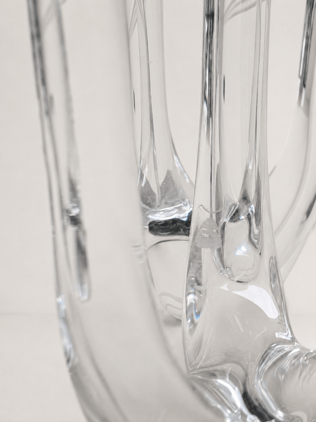 Pair of mid-century sculptural clear glass three-arm candelabras