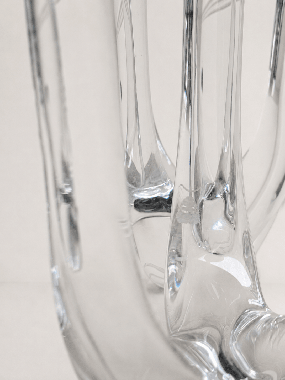 Pair of mid-century sculptural clear glass three-arm candelabras