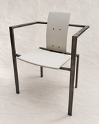 A modern industrial-style armchair with a dark metal frame and white seat and back panels, photographed against a light fabric backdrop.