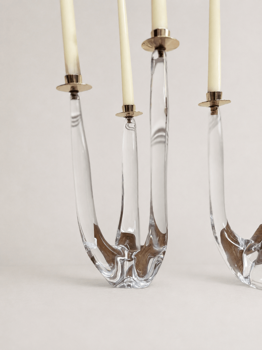 Pair of mid-century sculptural clear glass three-arm candelabras