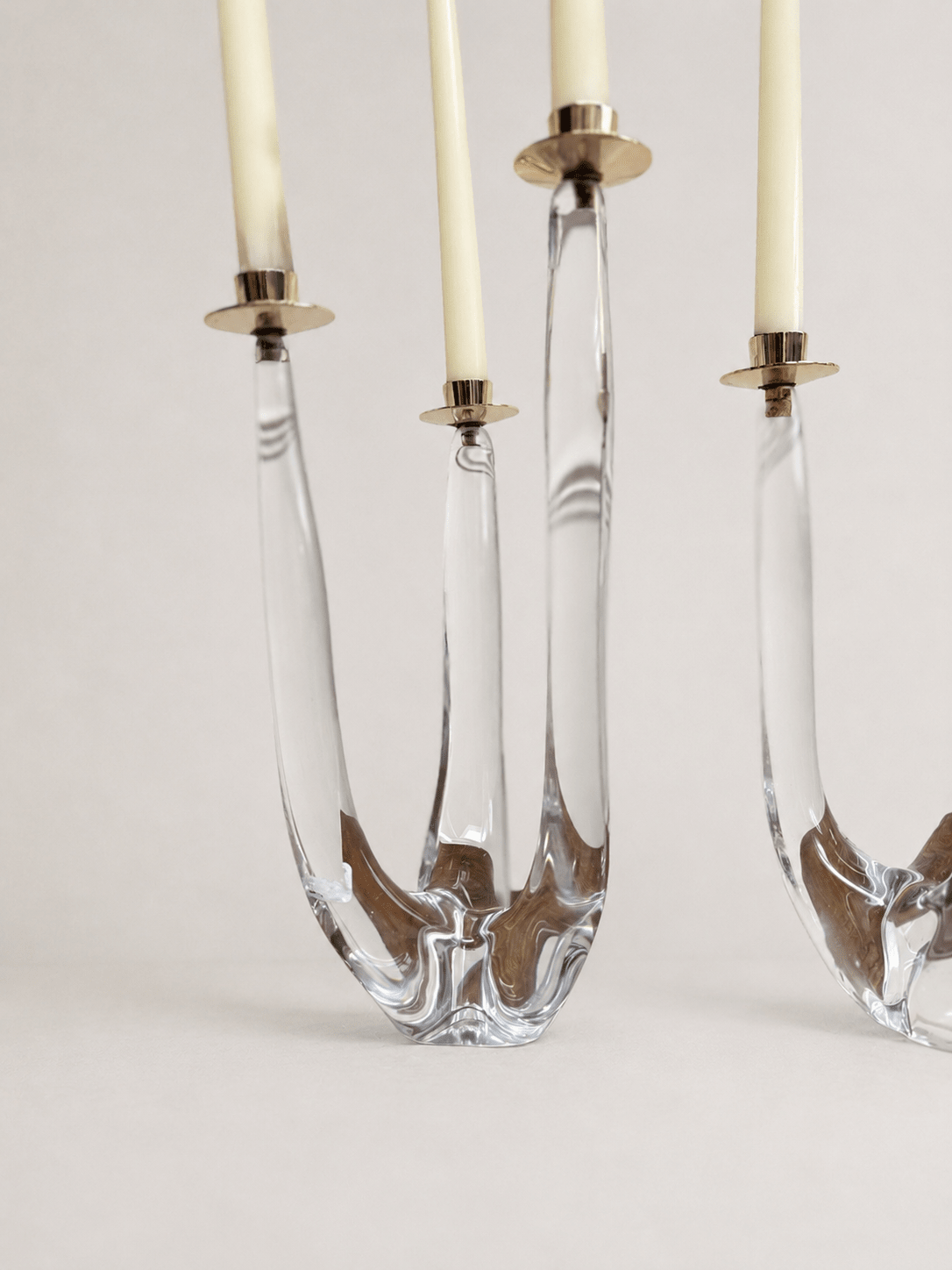 Pair of mid-century sculptural clear glass three-arm candelabras
