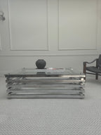 Italian chrome and glass stacked coffee table - alternate straight-on view in a room setting