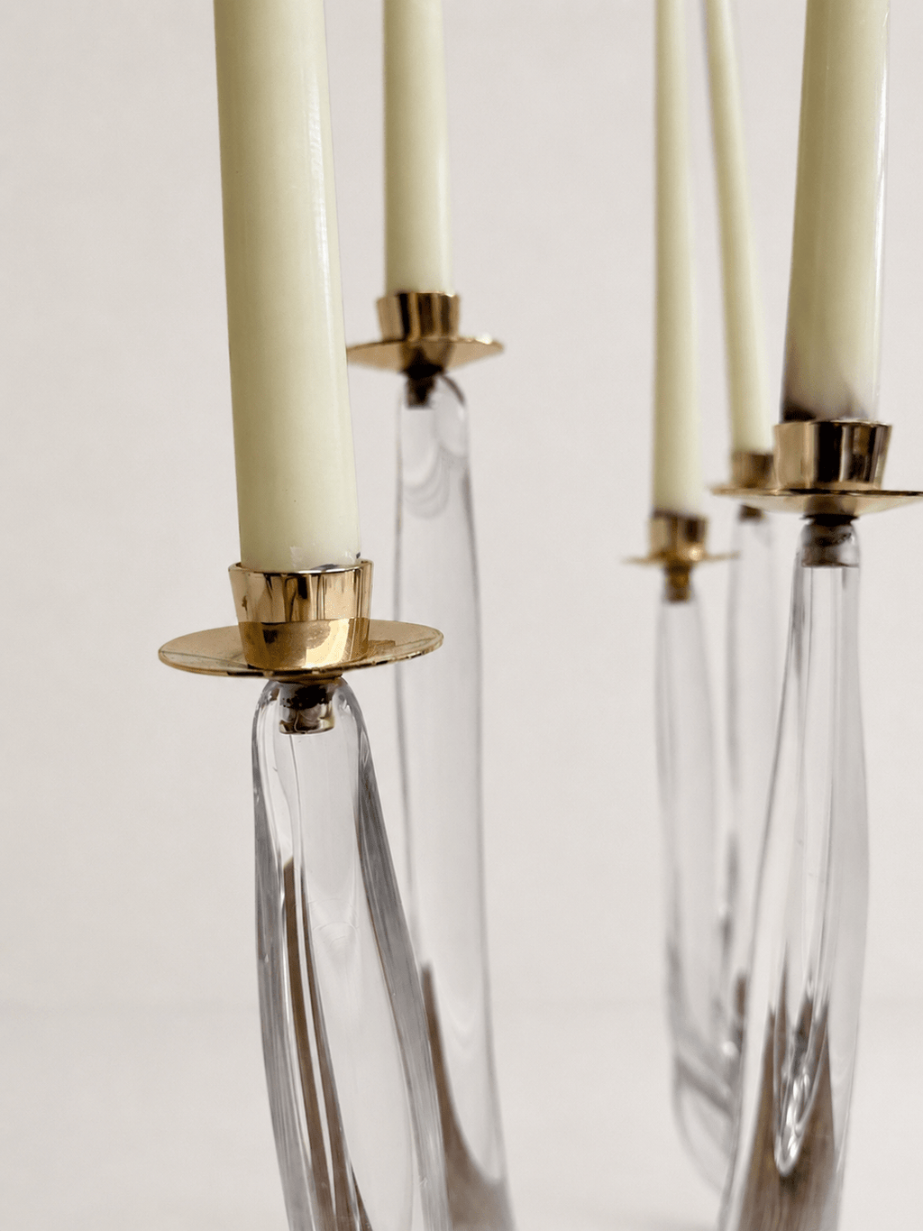 Pair of mid-century sculptural clear glass three-arm candelabras