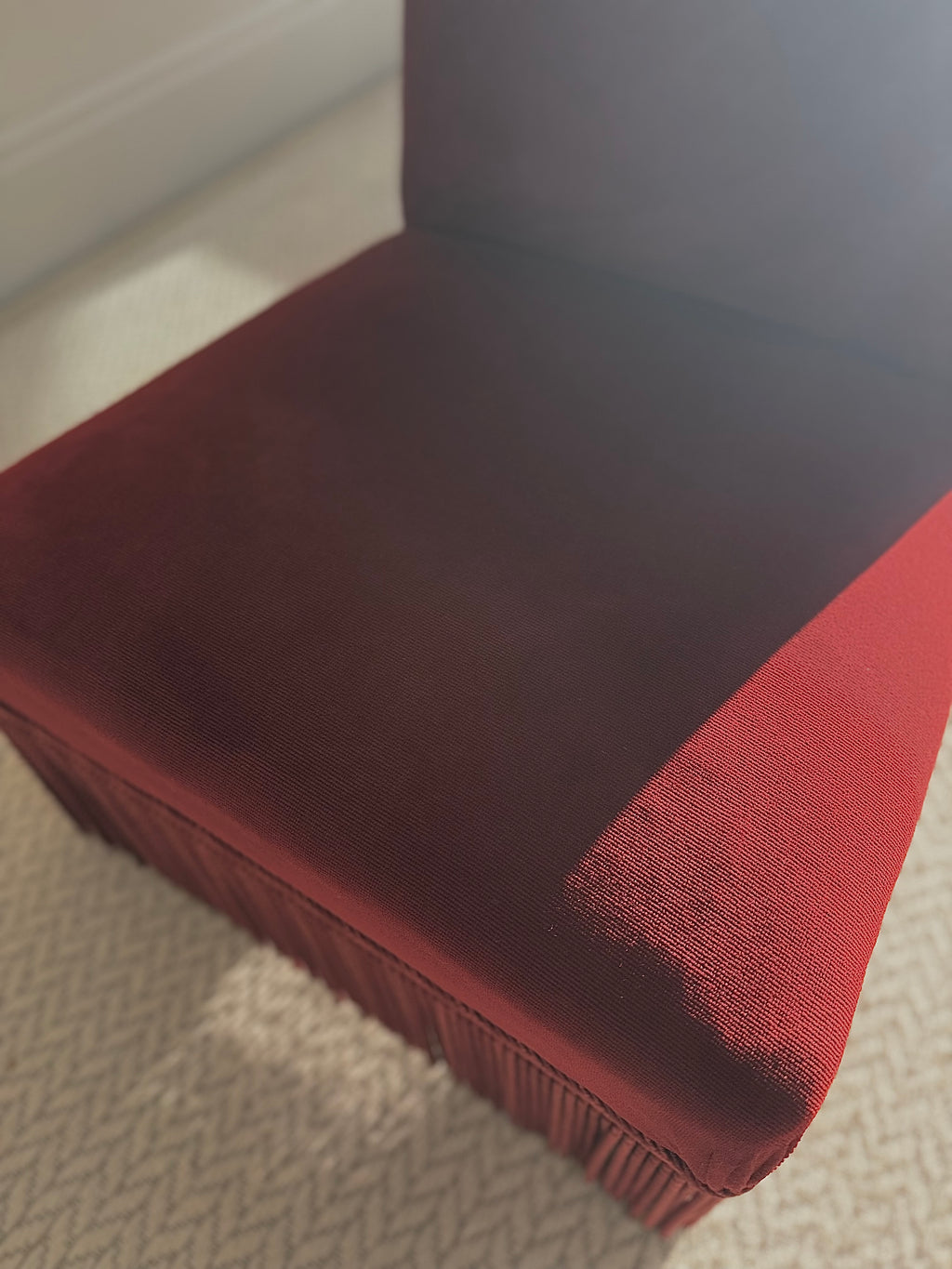 A pair of French Napoleon III red velvet slipper chairs with fringe