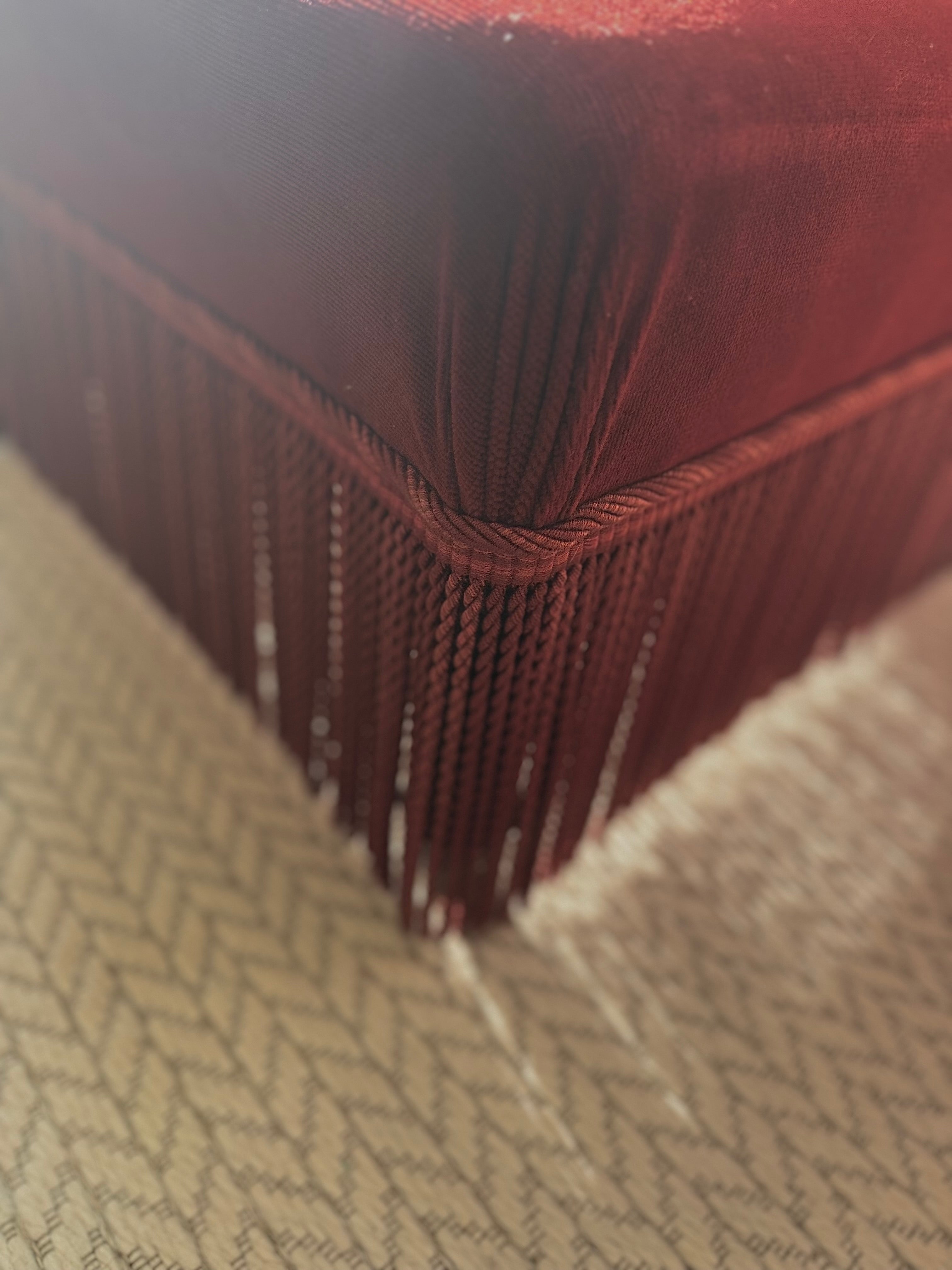 A pair of French Napoleon III red velvet slipper chairs with fringe