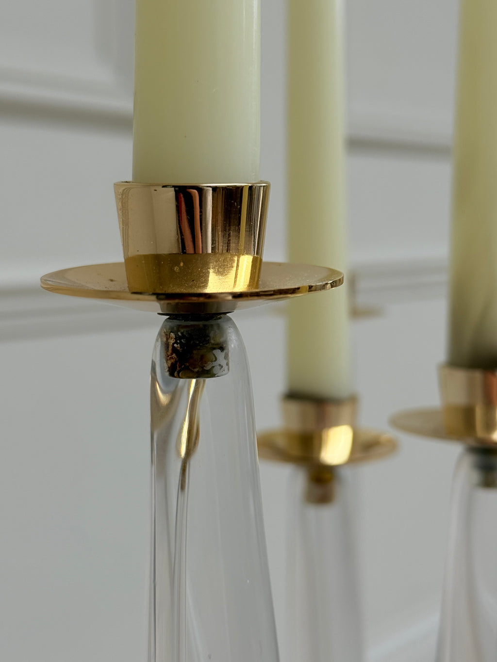 Pair of mid-century sculptural clear glass three-arm candelabras