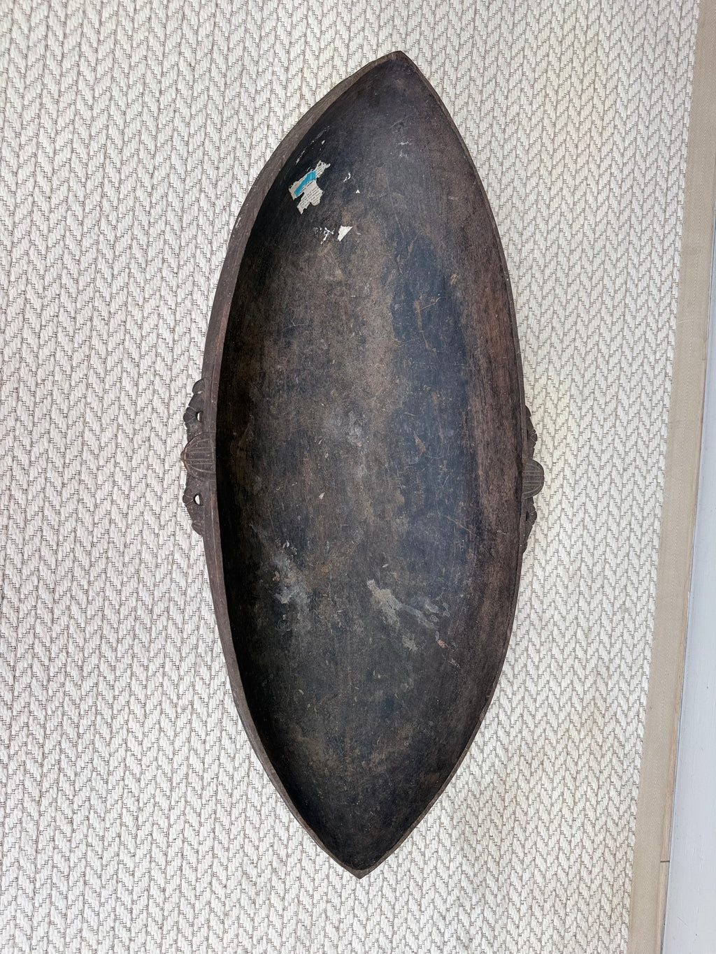 Interior of an early 20th century hand-carved wooden feasting bowl