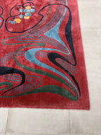 hand-knotted Nepalese Tibetan abstract rug - corner swirl motif and coloured pile, close-up