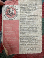 hand-knotted Nepalese Tibetan abstract rug - original Nepal certification label, close-up