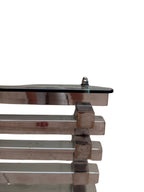 Italian chrome and glass stacked coffee table - side profile of the layered chrome rails