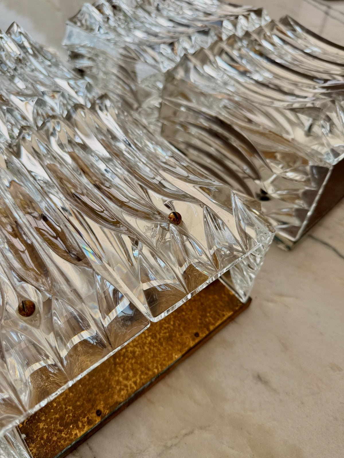 Pair Of Large Mid Century Faceted Glass Wall Sconces With Aged Brass Backplates