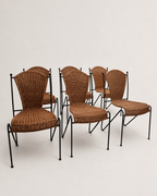 mid-century wicker and iron dining chairs - set grouped from the front