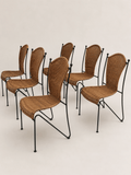 mid-century wicker and iron dining chairs - set grouped from the rear and side