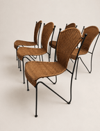 mid-century wicker and iron dining chairs - set arranged from the front three-quarter angle