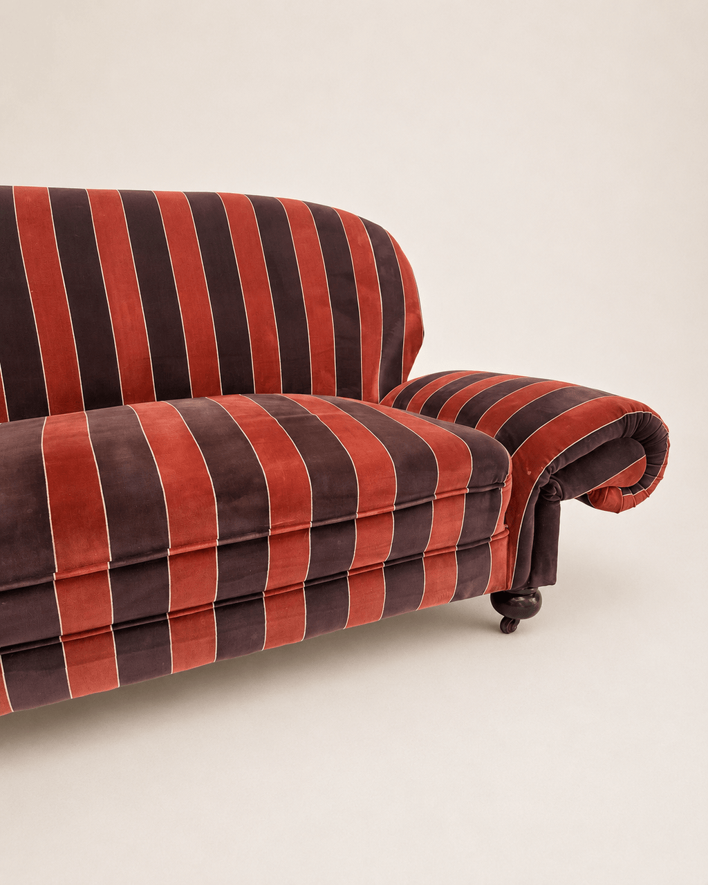 striped velvet curved-back two-seater sofa - striped velvet seat and right rolled arm, close-up
