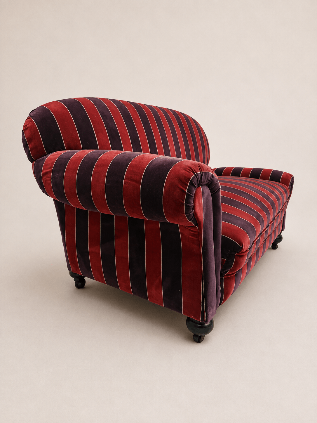 striped velvet curved-back two-seater sofa - full sofa from the left front angle