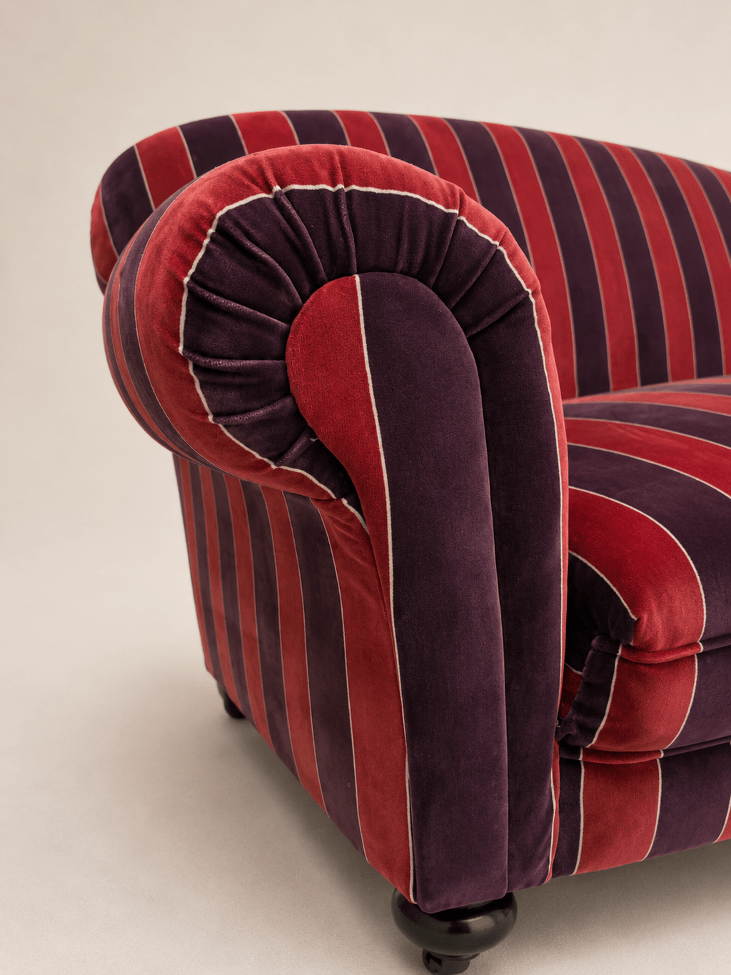 striped velvet curved-back two-seater sofa - rounded arm end and velvet pile, close-up